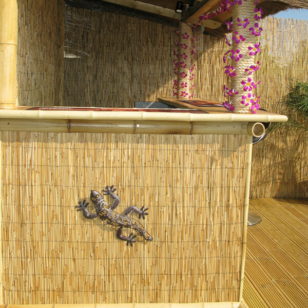 Customer image of a tiki bar in a garden decorated with bamboo thatch for the summer