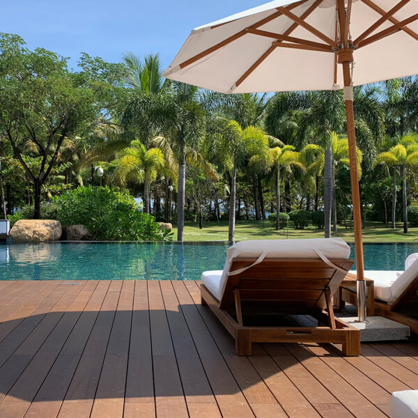 Project image of the Dasso CTECH bamboo decking used by a hotel poolside in the sunshine