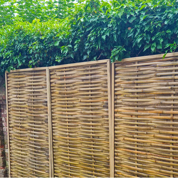 Woven bamboo fence panels installed in a customer's garden