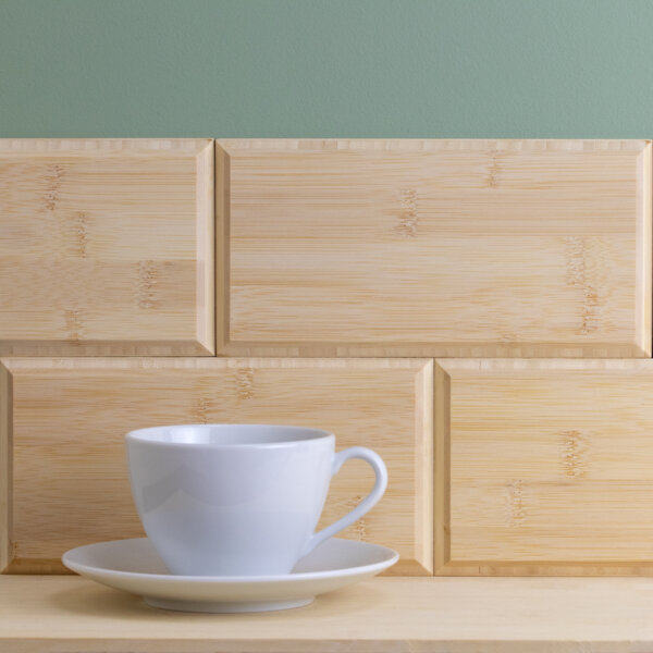 Natural bamboo brick wall tiles with a teacup in front
