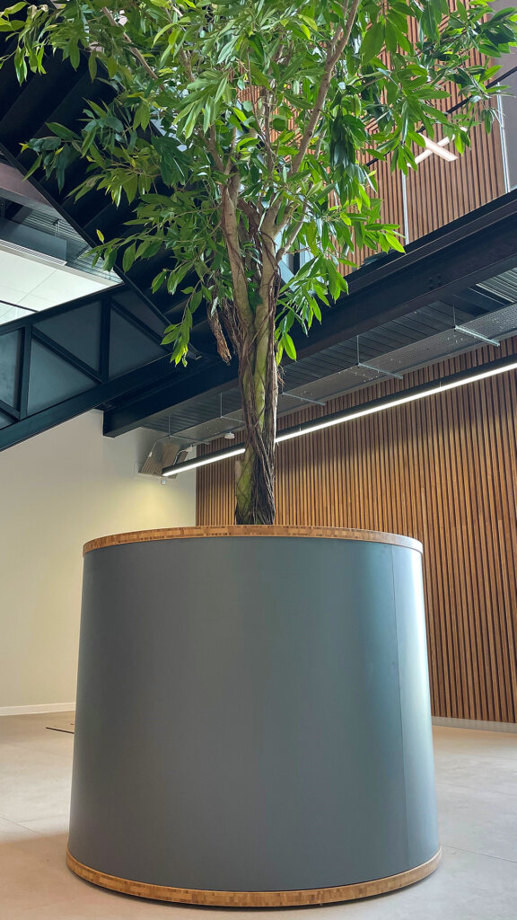 A project by Chapelwood Joinery - showing bamboo plyboards used as trim on a plant pot