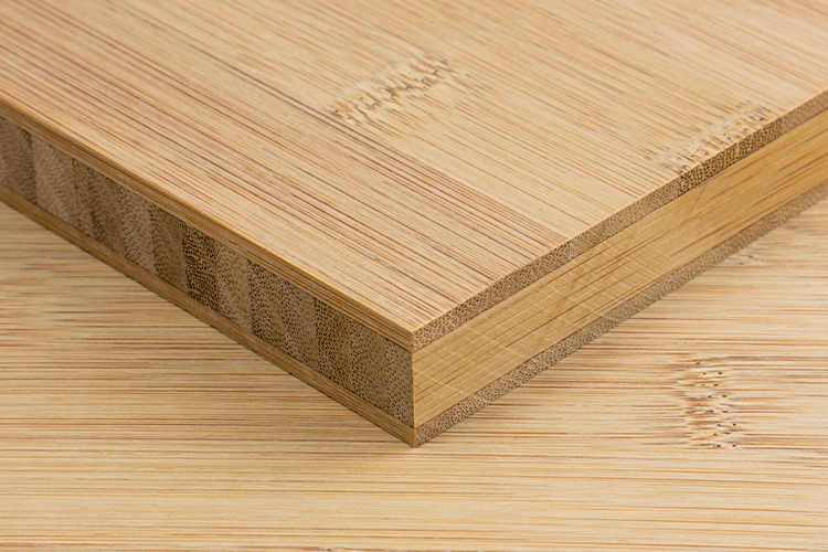 A close-up of the side profile of a 19/20mm 3 ply caramel bamboo plyboard