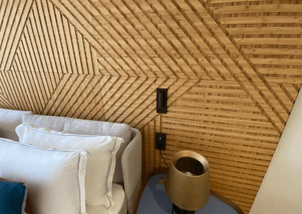 A closeup of fluted bamboo wall panelling with a geometric pattern made by Genesis Surfaces.